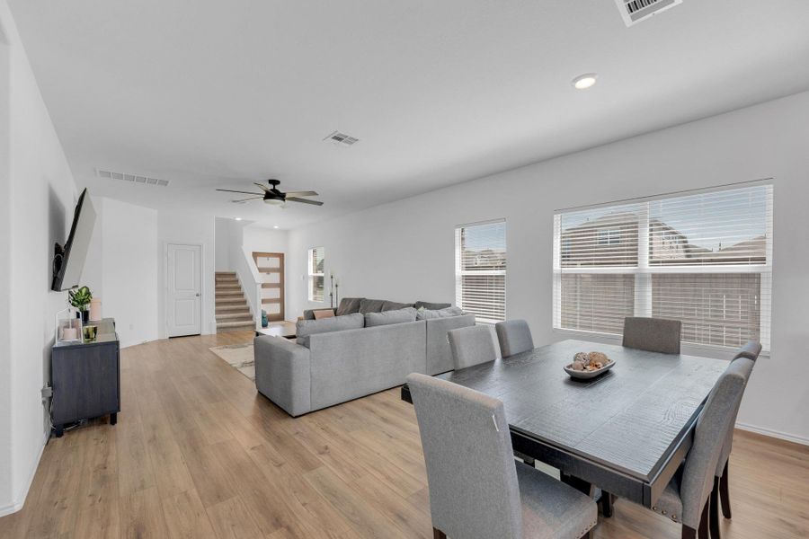 Dining area with recessed lighting, visible vents, and light wood-style flooring