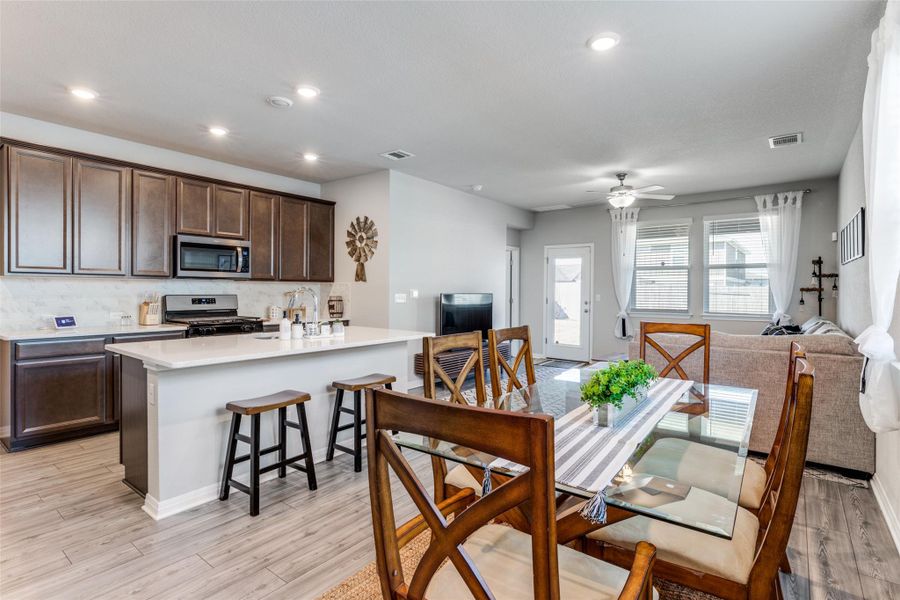 Dining room featuring light wood-style floors, recessed lighting, and a ceiling fan