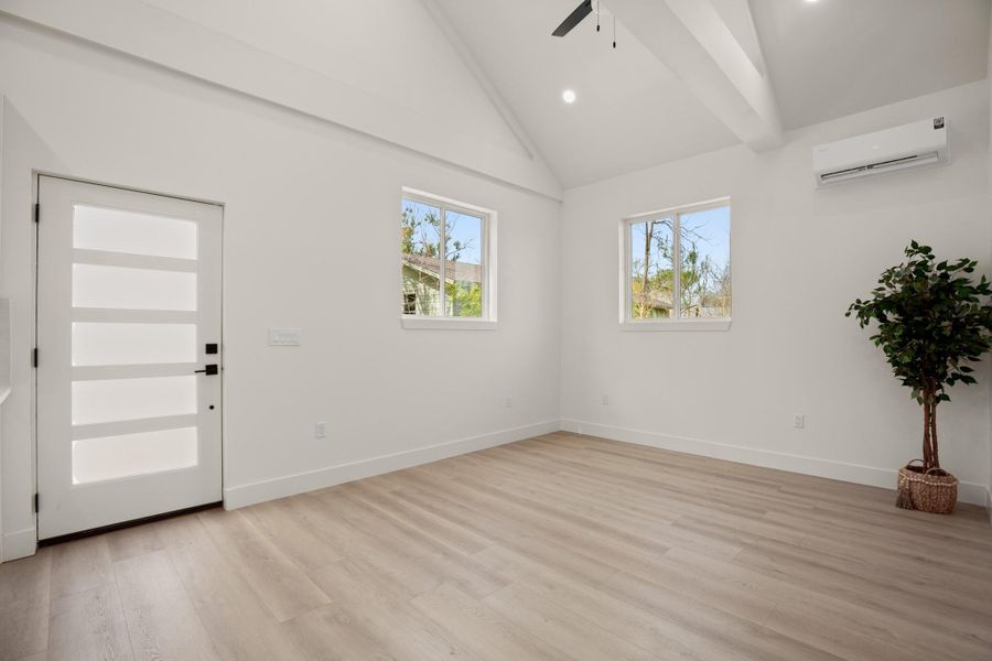 Entrance foyer featuring lofted ceiling, light wood-type flooring, recessed lighting, and ceiling fan