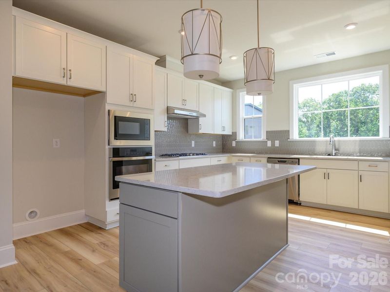 Gourmet Kitchen with large windows for ample natural light