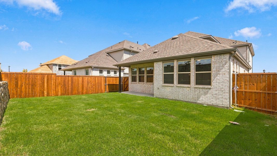 Exterior details and patio area of a home in Westridge Journey, McKinney (Image 22).