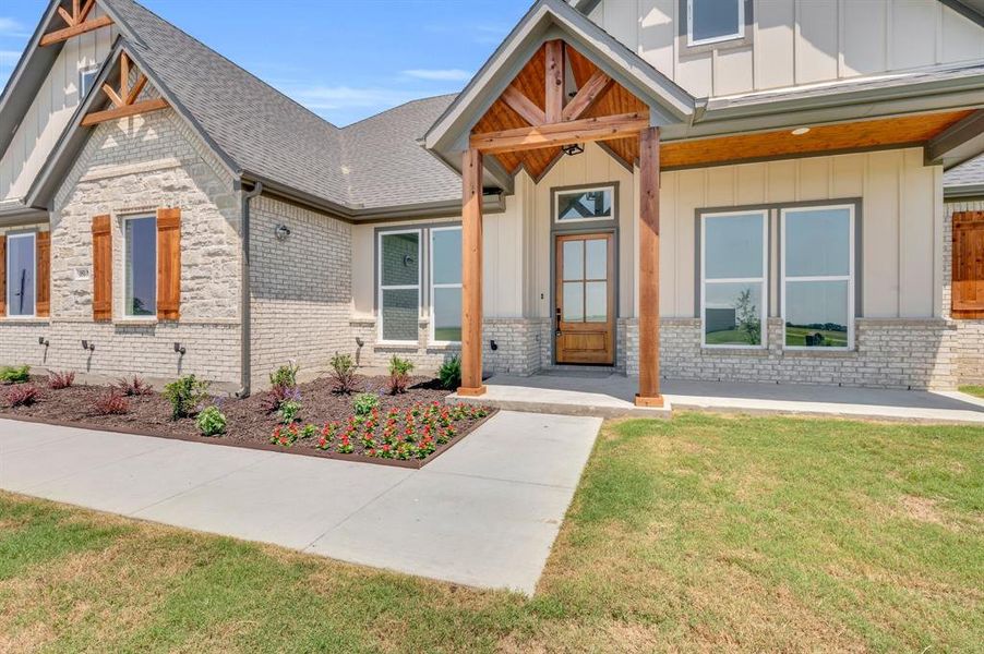 Craftsman-style house with a front lawn