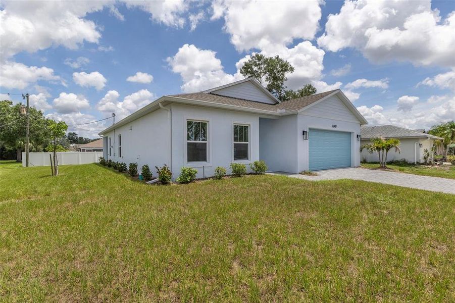 Front exterior of a new home in , Port Charlotte, FL, highlighting curb appeal (Image 1). Front exterior of a new home in , Port Charlotte, FL, highlighting curb appeal (Image 1).