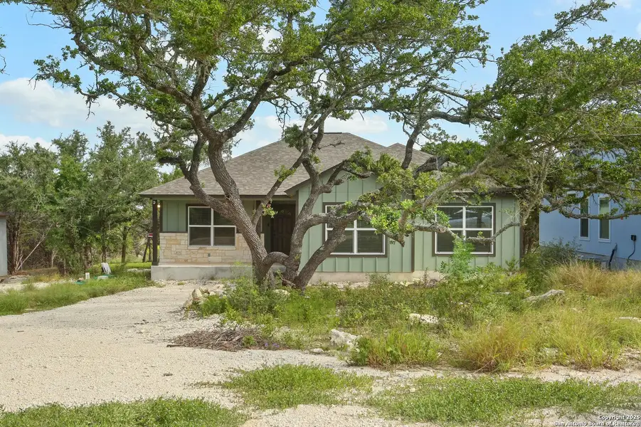Front exterior of a new home in , Spring Branch, TX, highlighting curb appeal (Image 12).