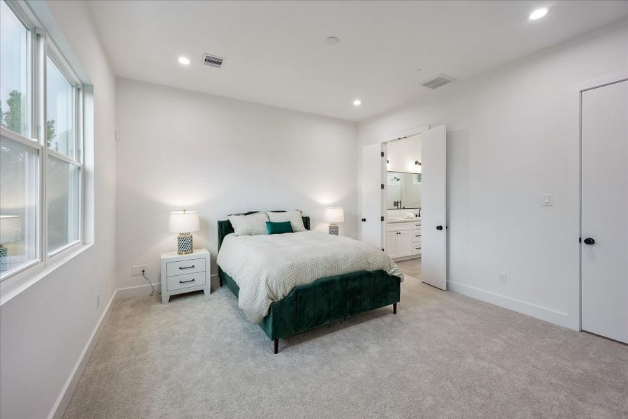 The expansive primary suite is a peaceful retreat, offering abundant space for a king-size bed and creating a relaxing escape at the end of the day. The expansive primary suite is a peaceful retreat, offering abundant space for a king-size bed and creating a relaxing escape at the end of the day.