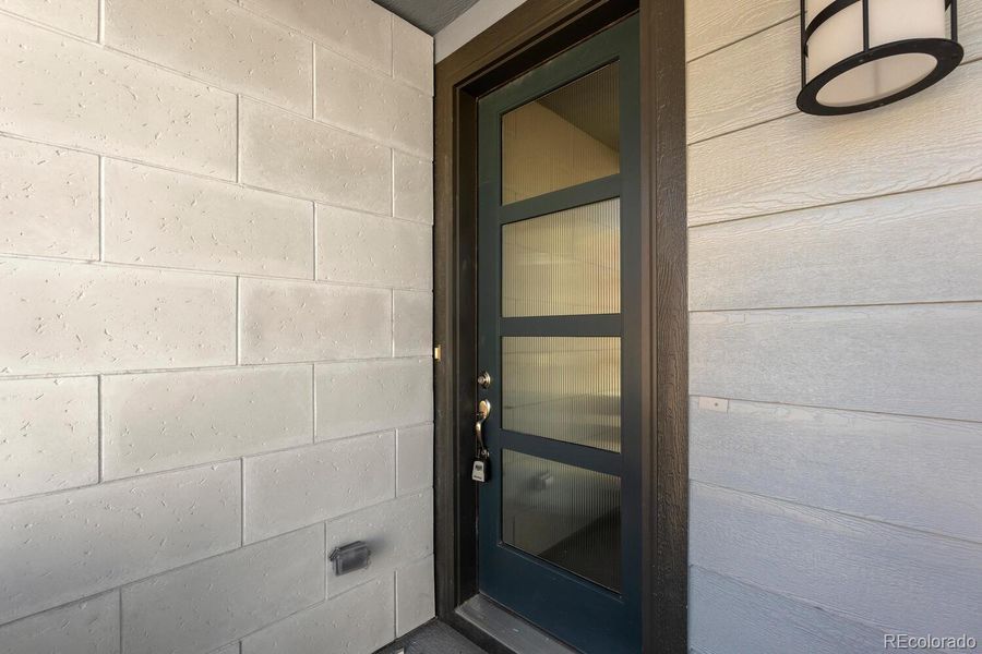 Exterior details and patio area of a home in The Villas Collection at Sterling Ranch, Littleton (Image 17).
