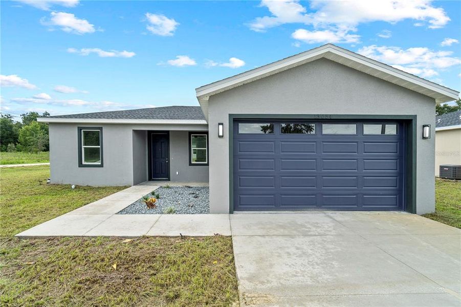 Front exterior of a new home in , Summerfield, FL, highlighting curb appeal (Image 2).