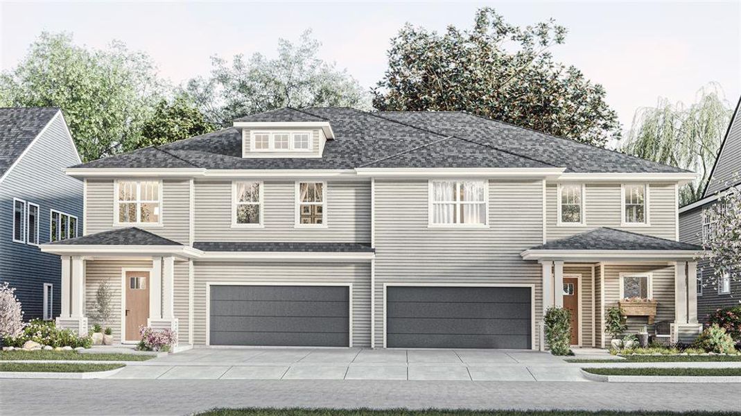 View of front facade featuring a garage