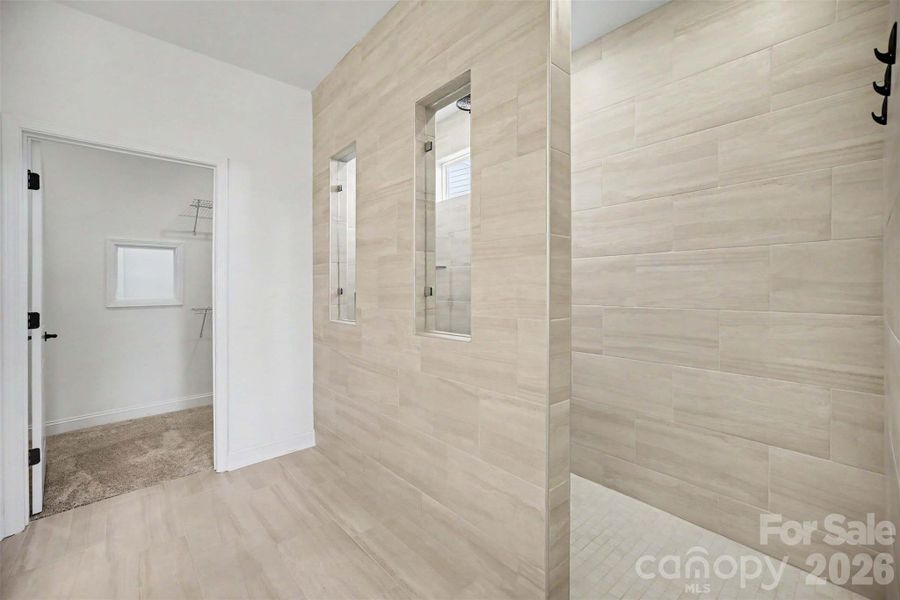 Primary Bath with step-in Shower and built in bench.