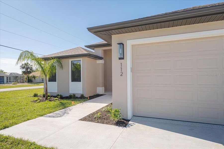 Front exterior of a new home in , Rotonda West, FL, highlighting curb appeal (Image 18).