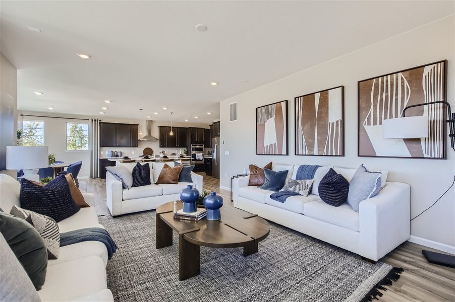 A living room with a couch and a coffee table. A living room with a couch and a coffee table.