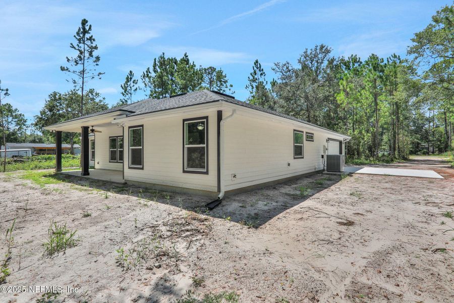 Front exterior of a new home in , Middleburg, FL, highlighting curb appeal (Image 24).