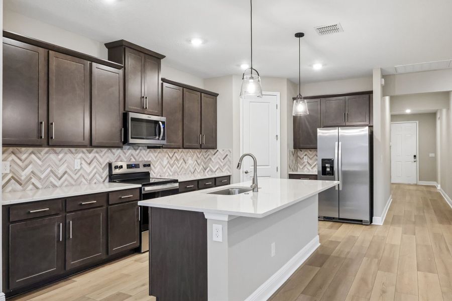 Furnished interior view inside a new home in Legends Preserve - Signature Series, Daytona Beach (Image 4).