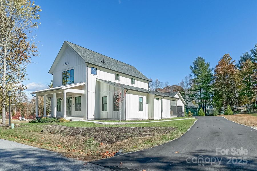 Front exterior of a new home in , Flat Rock, NC, highlighting curb appeal (Image 1). Front exterior of a new home in , Flat Rock, NC, highlighting curb appeal (Image 1).
