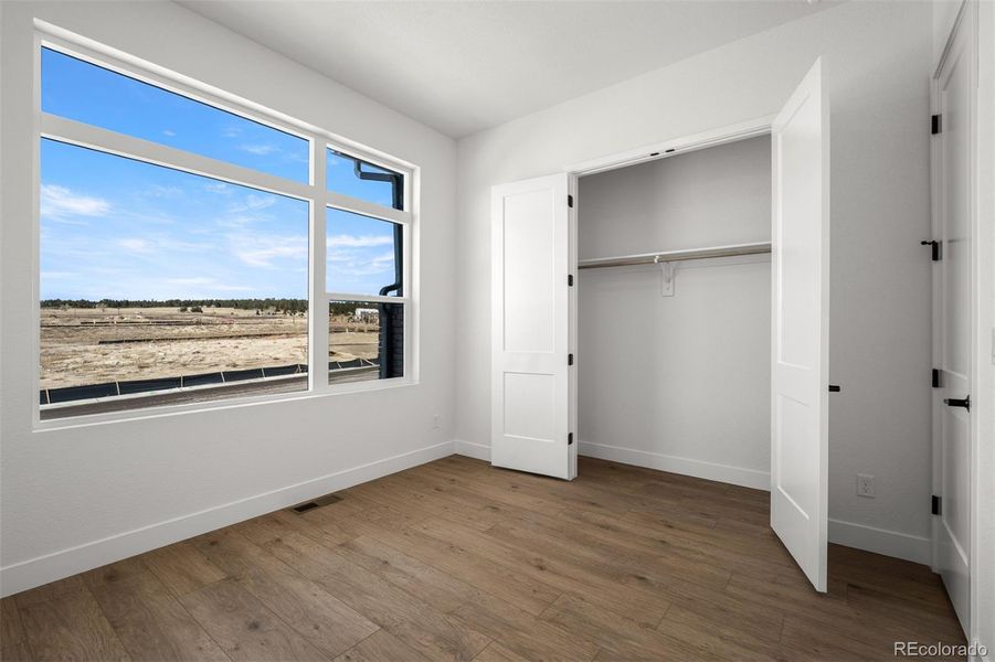 Spacious, unfurnished interior of a new home in Wolf Ranch - Enclave Collection, Colorado Springs (Image 22).
