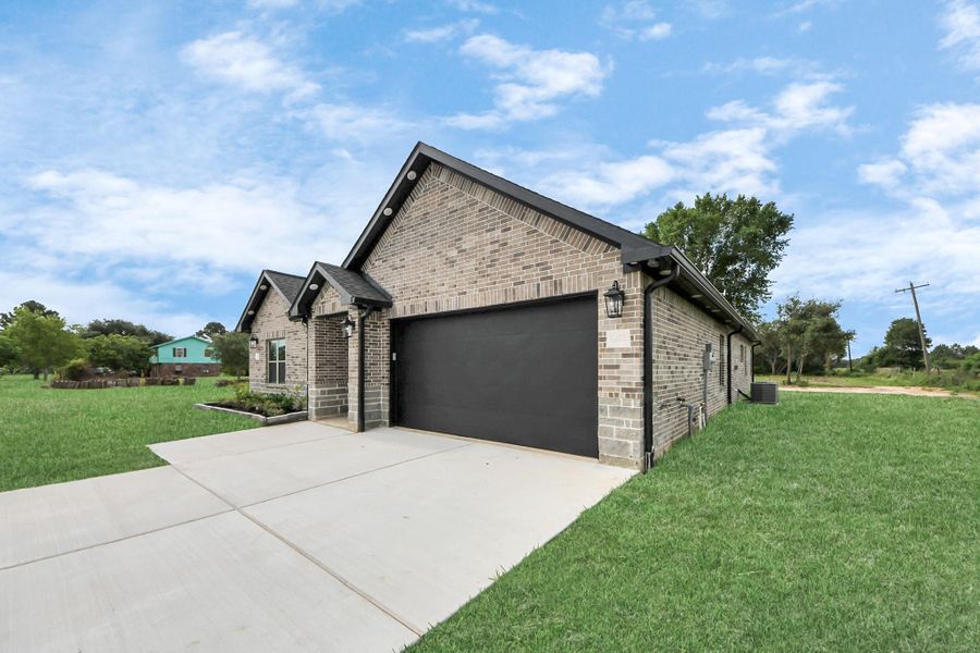 Front exterior of a new home in , Waller, TX, highlighting curb appeal (Image 24).