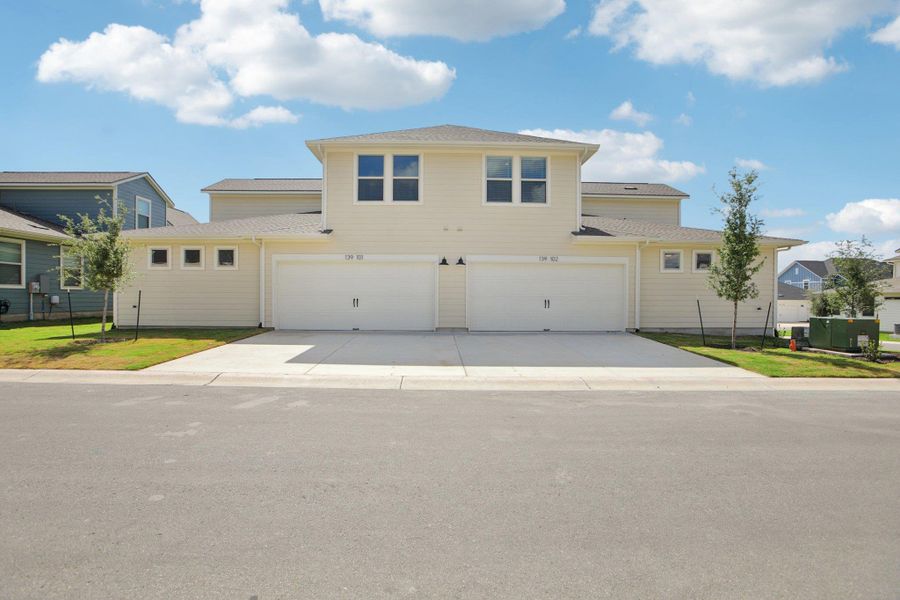 Traditional-style home with driveway and a garage