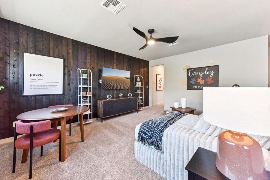 A dark wood accent wall anchors this comfortable living area. A dark wood accent wall anchors this comfortable living area.