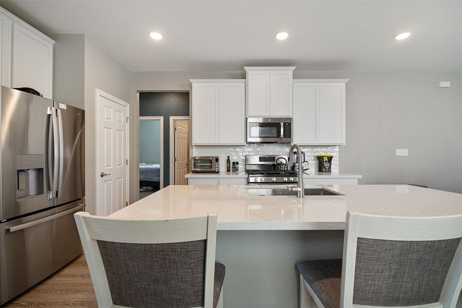 Open kitchen with bar seating
