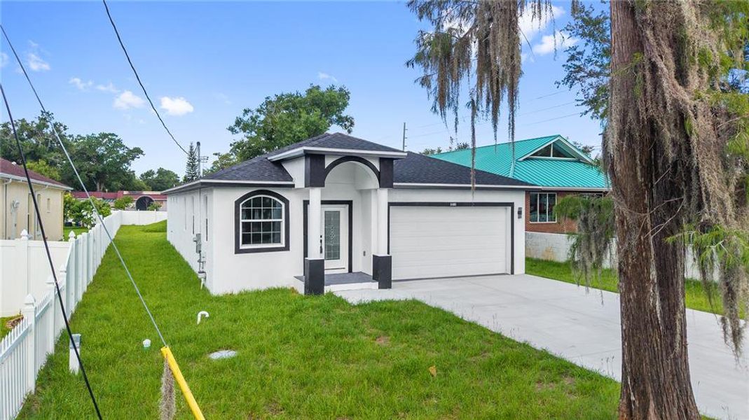 Front exterior of a new home in , Tampa, FL, highlighting curb appeal (Image 25).