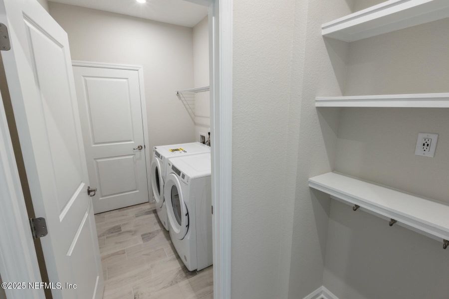 Furnished interior view inside a new home in Lakes at Bella Lago, Green Cove Springs (Image 17).