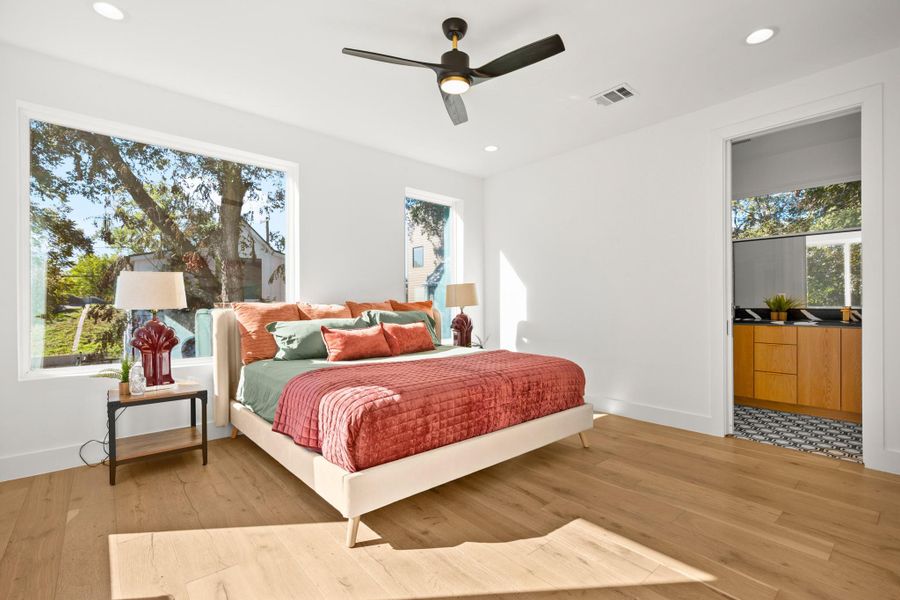 Primary Bedroom featuring recessed lighting, light wood finished floors, and ceiling fan Primary Bedroom featuring recessed lighting, light wood finished floors, and ceiling fan