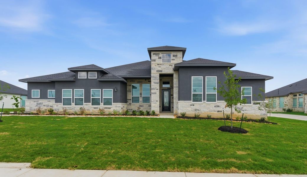 Front exterior of a new home in Sienna Lakes, San Antonio, TX, highlighting curb appeal (Image 1). Front exterior of a new home in Sienna Lakes, San Antonio, TX, highlighting curb appeal (Image 1).