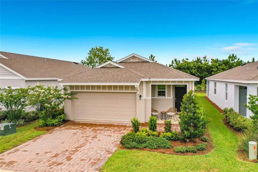 Front exterior of a new home in Ocala Preserve, Ocala, FL, highlighting curb appeal (Image 2). Front exterior of a new home in Ocala Preserve, Ocala, FL, highlighting curb appeal (Image 2).