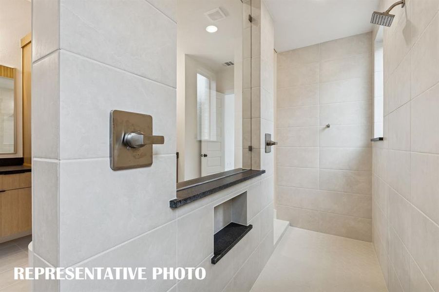 Experience a spa like retreat every day in this wonderful bath with double walk through shower and freestanding tub.  REPRESENTATIVE PHOTO