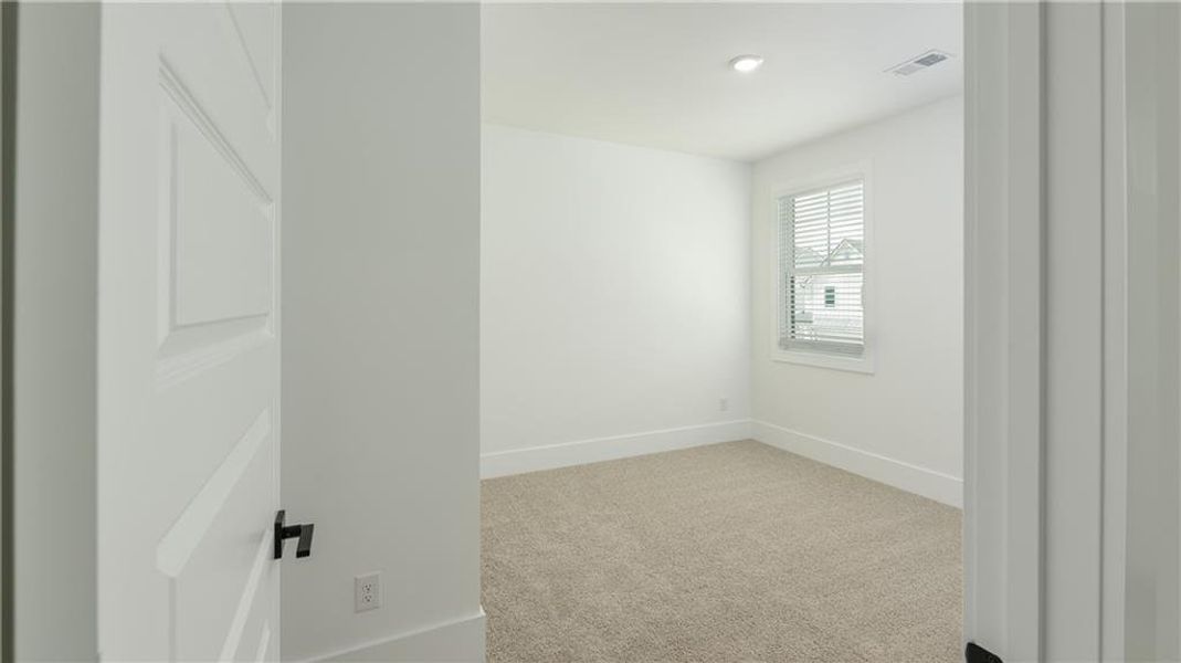 Spacious, unfurnished interior of a new home in The Village at Sandy Plains, Marietta (Image 15).