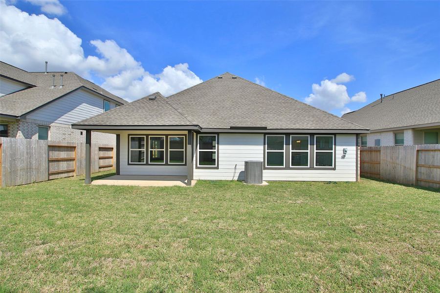 Exterior details and patio area of a home in Sunterra, Katy (Image 18).