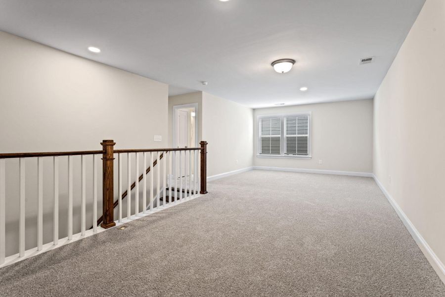 Spacious, unfurnished interior of a new home in Tidewater at Lakes of Cane Bay, Summerville (Image 21).
