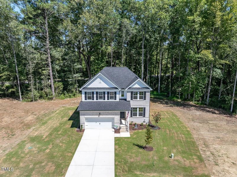 Front exterior of a new home in Wellers Knoll, Lillington, NC, highlighting curb appeal (Image 18).