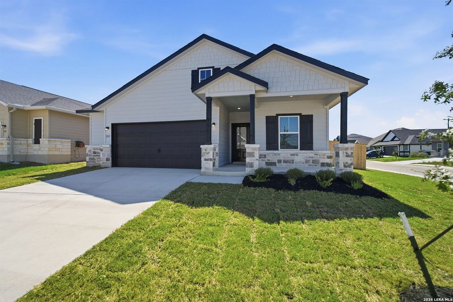 Front exterior of a new home in Swenson Heights, Seguin, TX, highlighting curb appeal (Image 14).