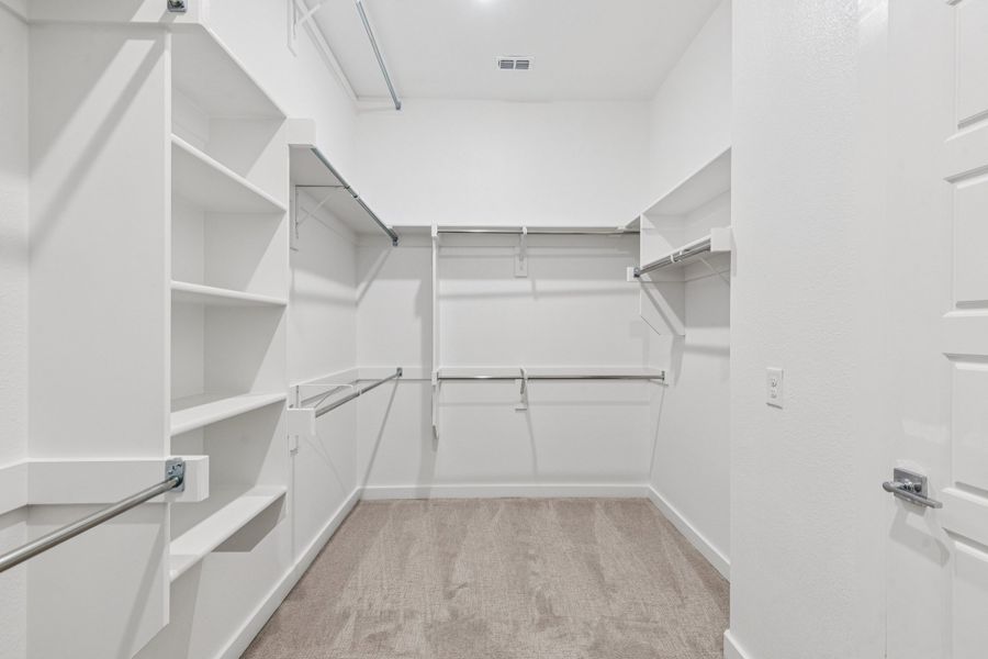 Primary Closet in the Picasso II home plan by Trophy Signature Homes – REPRESENTATIVE PHOTO Primary Closet in the Picasso II home plan by Trophy Signature Homes – REPRESENTATIVE PHOTO