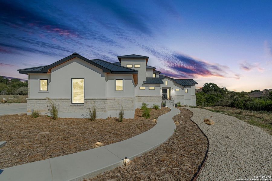 Front exterior of a new home in , New Braunfels, TX, highlighting curb appeal (Image 28). Front exterior of a new home in , New Braunfels, TX, highlighting curb appeal (Image 28).