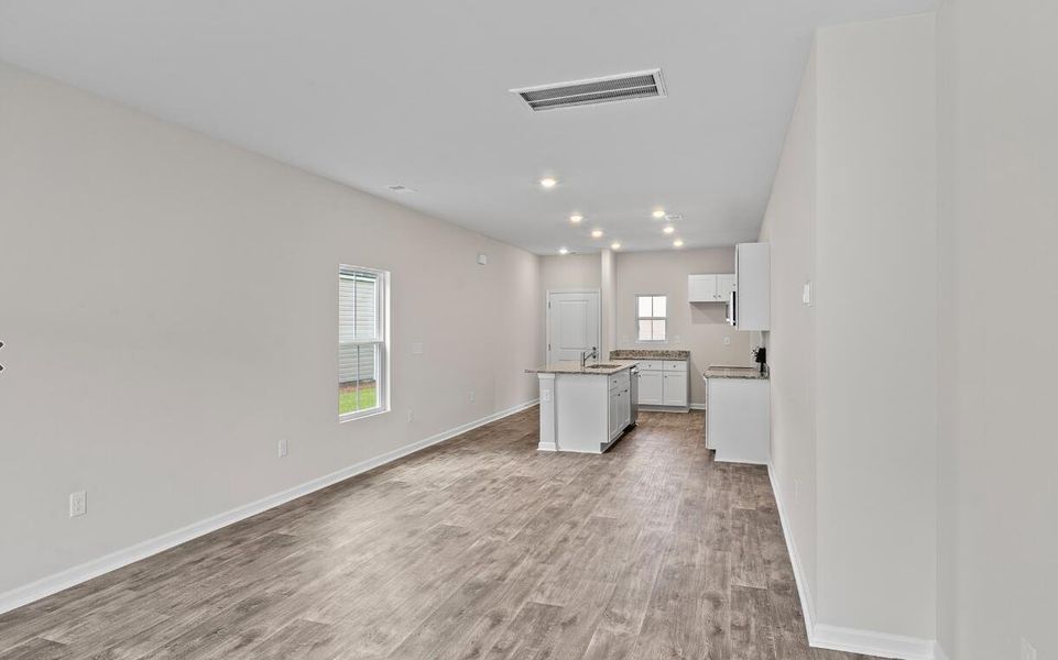 Spacious, unfurnished interior of a new home in Lindera Preserve at Cane Bay Plantation: American Dream Series - Ph 15, Summerville (Image 9). Spacious, unfurnished interior of a new home in Lindera Preserve at Cane Bay Plantation: American Dream Series - Ph 15, Summerville (Image 9).