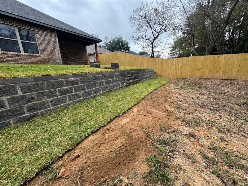 View of fenced backyard
