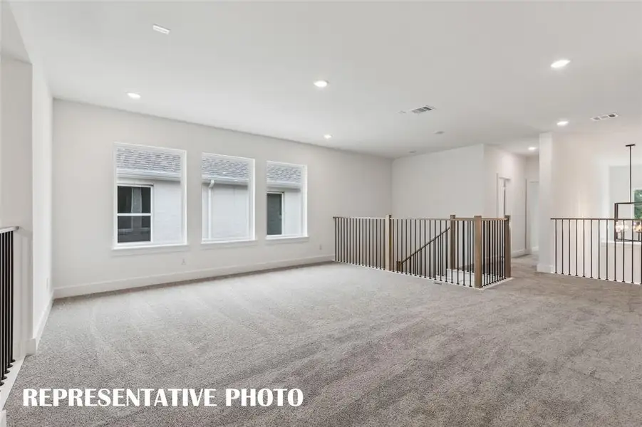 This spacious, light filled game room is the perfect place to host those big game day parties!  REPRESENTATIVE PHOTO