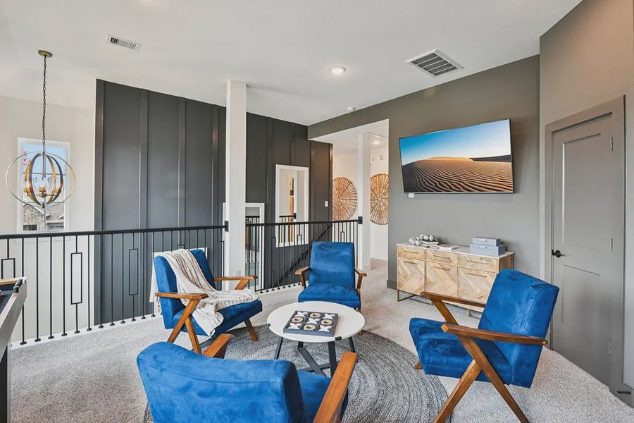 Furnished interior view inside a new home in Meridiana Chateau, Manvel (Image 31).