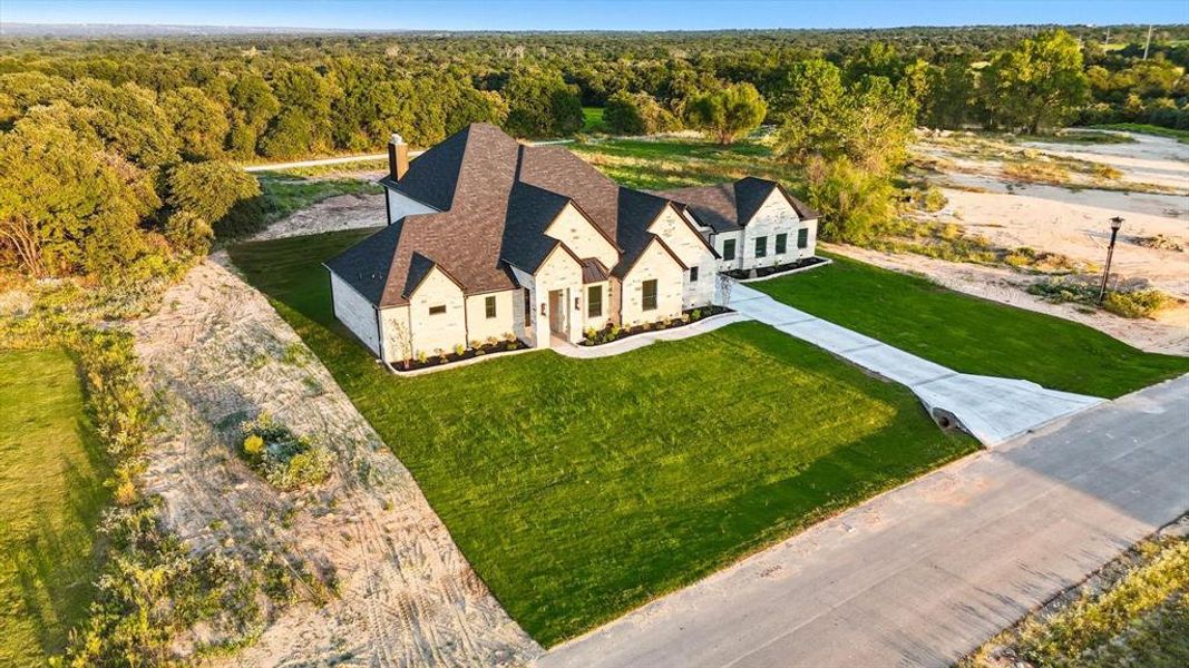 View from above of property with a heavily wooded area View from above of property with a heavily wooded area