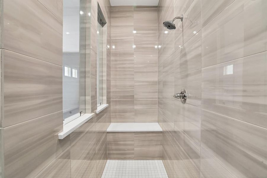 Bathroom featuring a tile walk-in shower