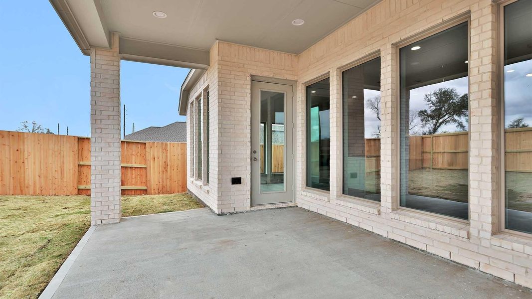 Exterior details and patio area of a home in Meridiana, Manvel (Image 3). Exterior details and patio area of a home in Meridiana, Manvel (Image 3).