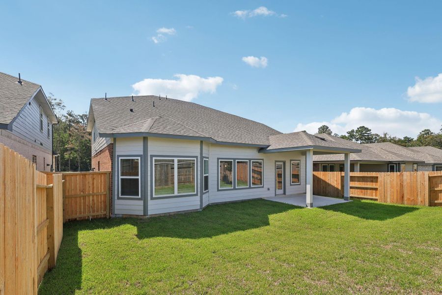 Front exterior of a new home in Stewart's Ranch, Conroe, TX, highlighting curb appeal (Image 15).