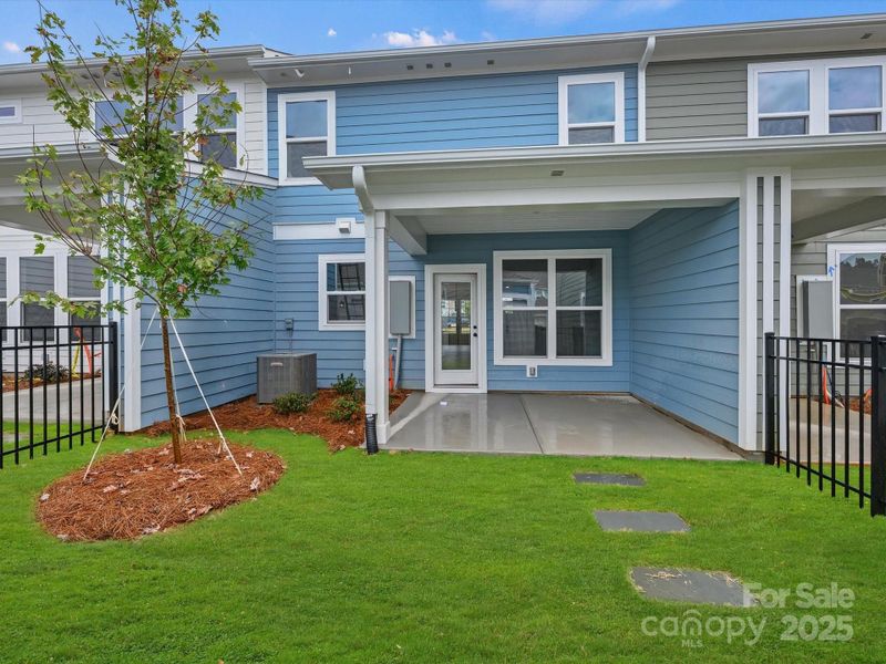 Front exterior of a new home in North Creek Village - Townhomes, Huntersville, NC, highlighting curb appeal (Image 20). Front exterior of a new home in North Creek Village - Townhomes, Huntersville, NC, highlighting curb appeal (Image 20).