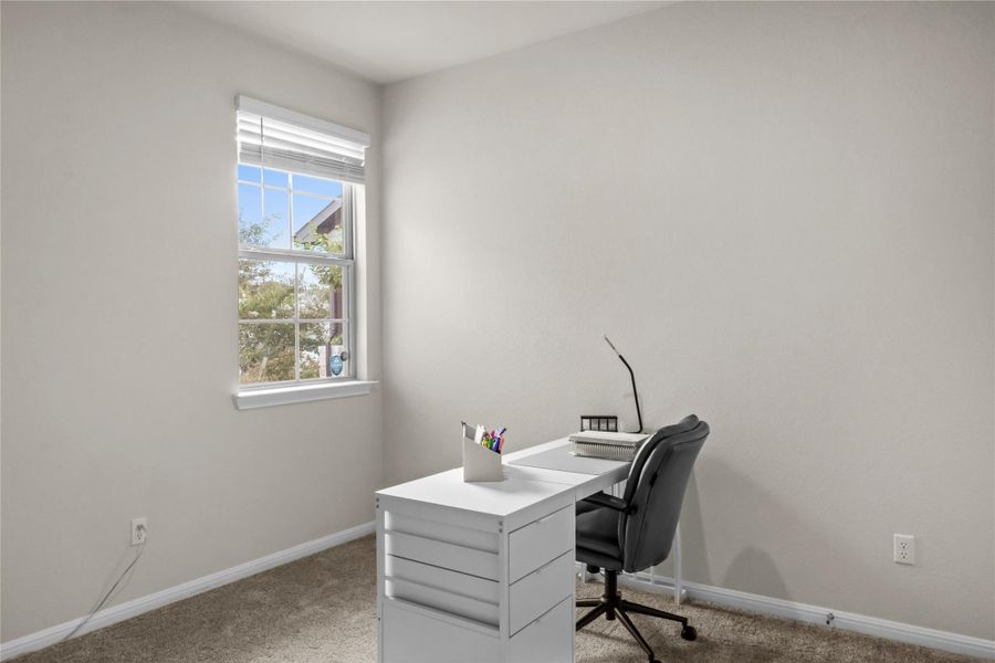 3rd bedroom featuring light colored carpet