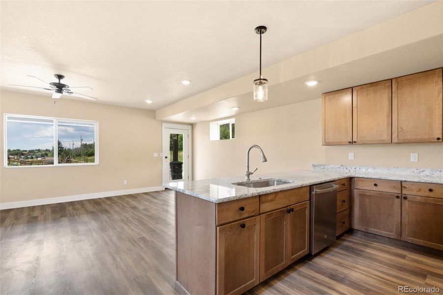 Walkout to wrap around side porch from living room/kitchen/dining space Walkout to wrap around side porch from living room/kitchen/dining space