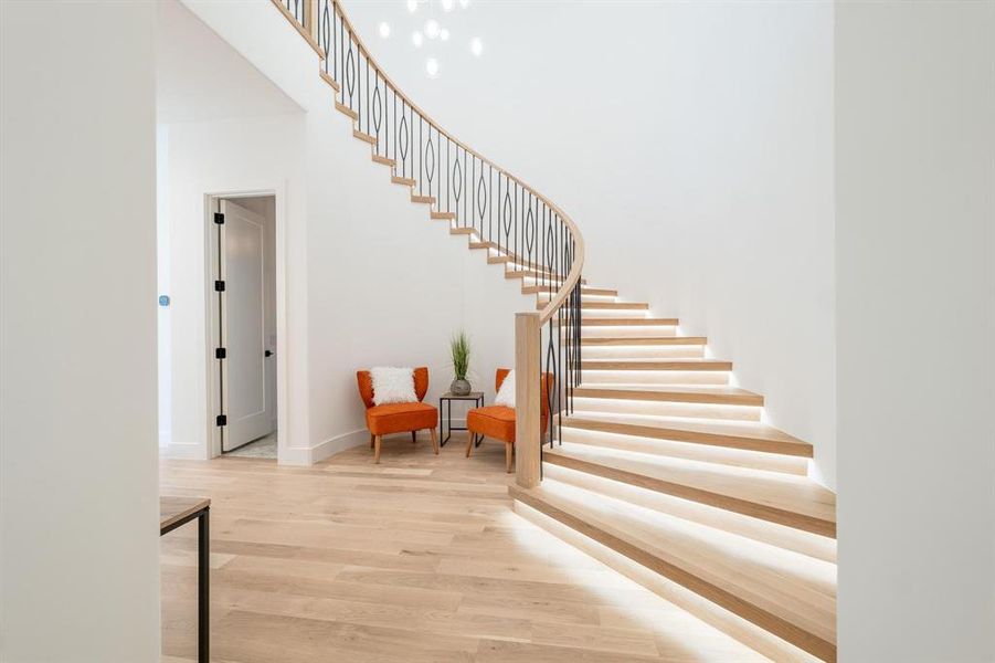 Staircase featuring wood-type flooring