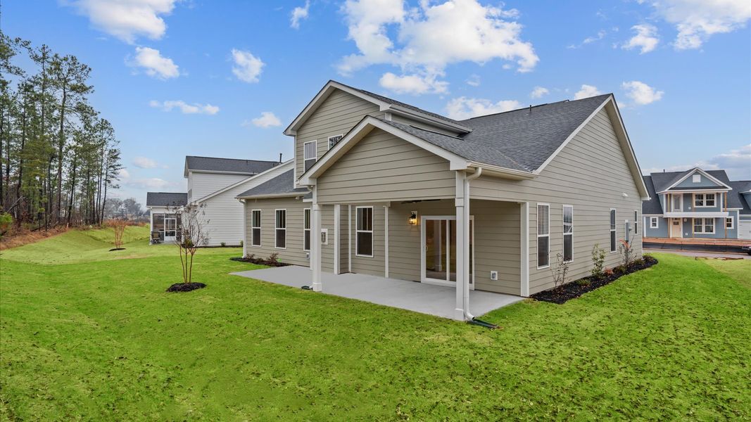 Notable exterior includes a rear covered porch designed for year-round enjoyment