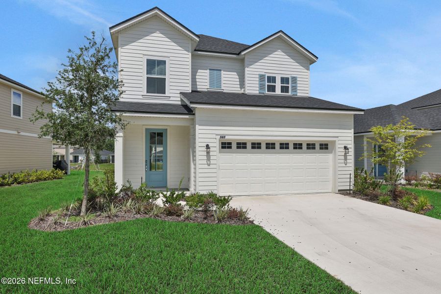 Front exterior of a new home in TrailMark, St. Augustine, FL, highlighting curb appeal (Image 2). Front exterior of a new home in TrailMark, St. Augustine, FL, highlighting curb appeal (Image 2).